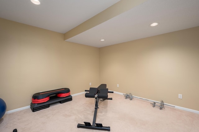 exercise room featuring carpet flooring, recessed lighting, and baseboards