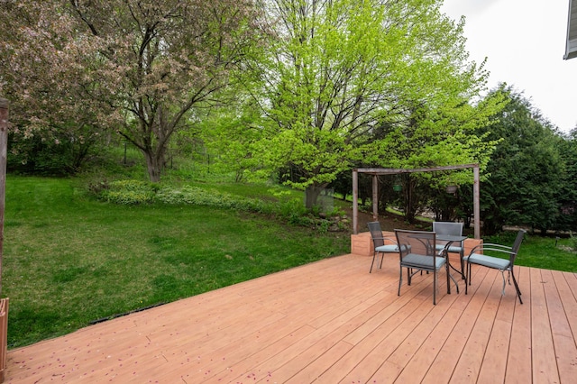 wooden deck featuring a yard