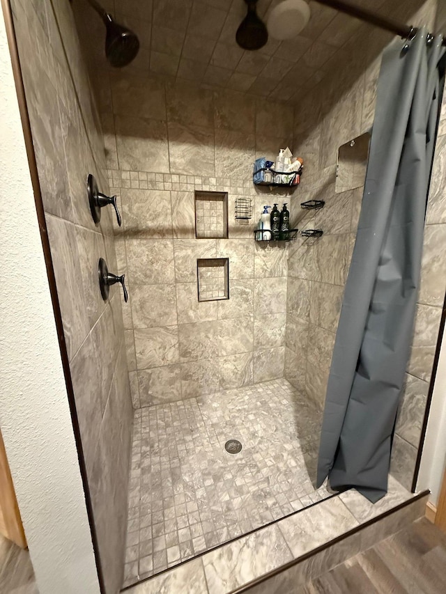 bathroom with a shower stall