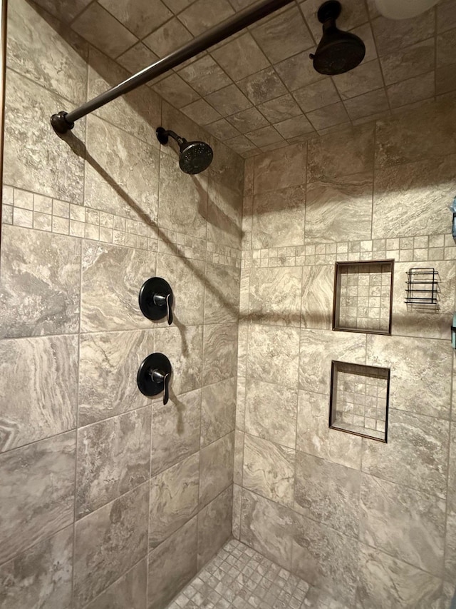 full bath with a shower stall