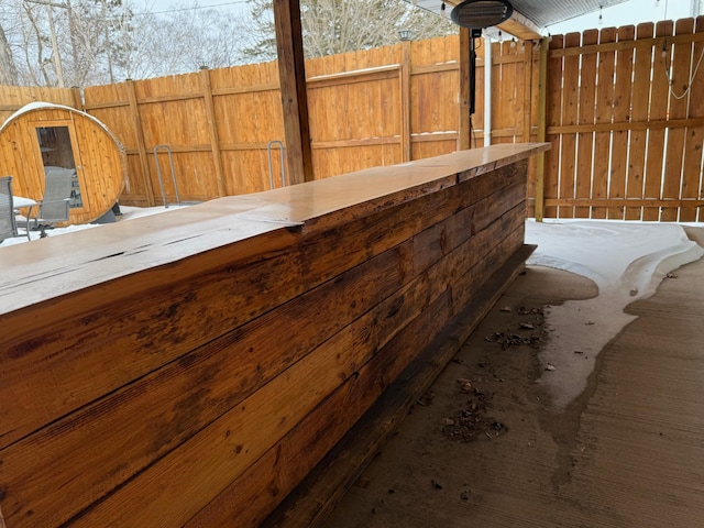 view of patio featuring fence