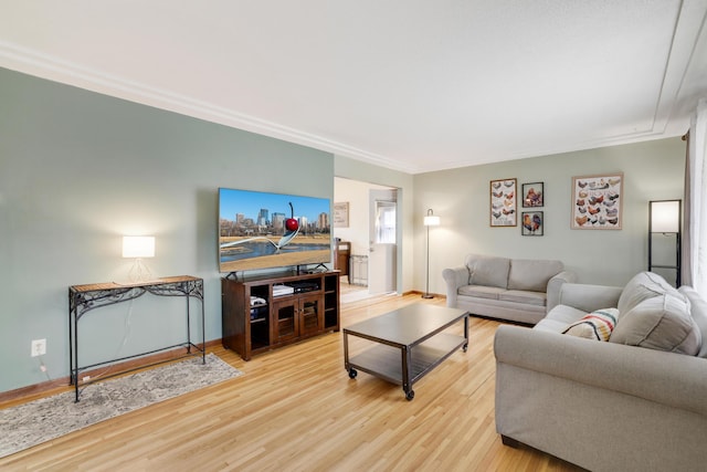 living room featuring baseboards and wood finished floors