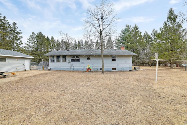 back of house featuring fence