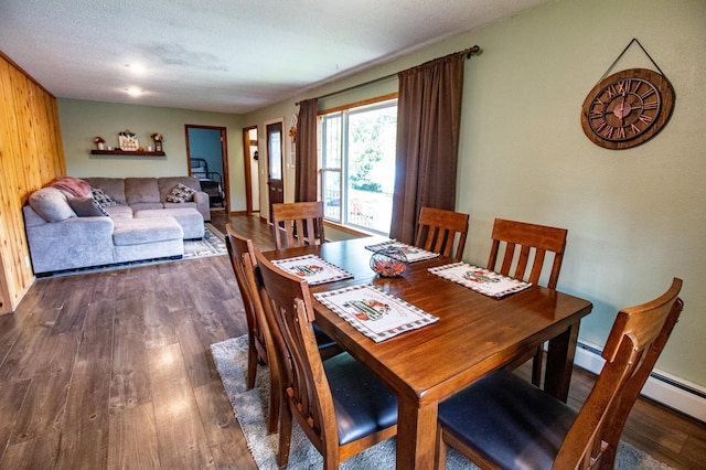 dining room with dark wood-type flooring