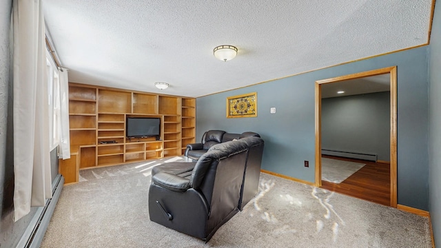 carpeted living area with a baseboard heating unit, a textured ceiling, a baseboard radiator, and baseboards