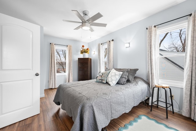 949 9th Ave SE, Rochester, MN 55904 - bedroom featuring multiple windows, wood finished floors, and a ceiling fan