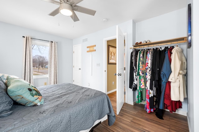 949 9th Ave SE, Rochester, MN 55904 - bedroom featuring a closet, a ceiling fan, visible vents, wood finished floors, and baseboards