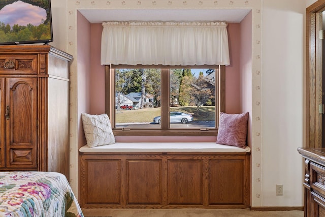 bedroom with wallpapered walls and baseboards