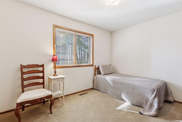 bedroom featuring carpet, visible vents, and baseboards