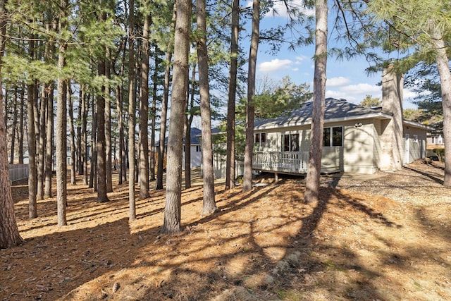 view of yard with a wooden deck