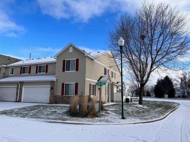 traditional home featuring driveway and an attached garage