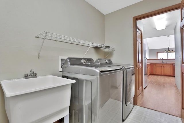 13413 Pine View Pl, Lindstrom, MN 55045 - clothes washing area with washing machine and dryer and light floors