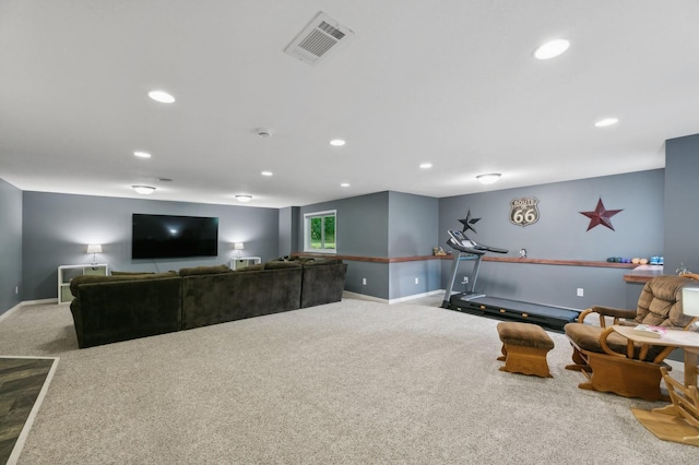 carpeted living room featuring baseboards, visible vents, and recessed lighting