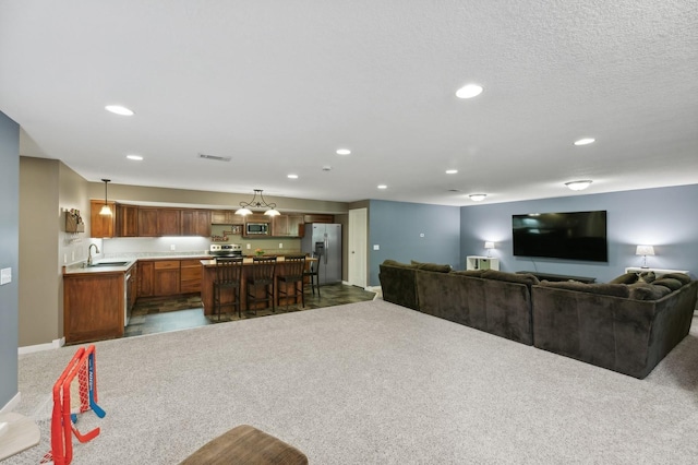 living area featuring recessed lighting, visible vents, dark carpet, and baseboards