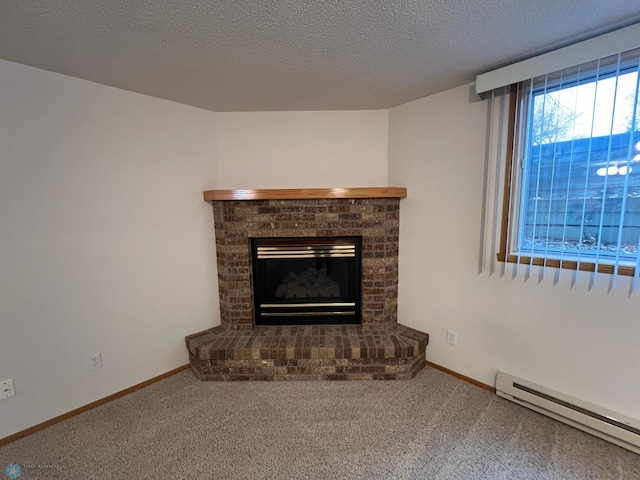 unfurnished living room featuring a brick fireplace, baseboards, a baseboard heating unit, and carpet