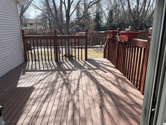 deck with a fenced backyard