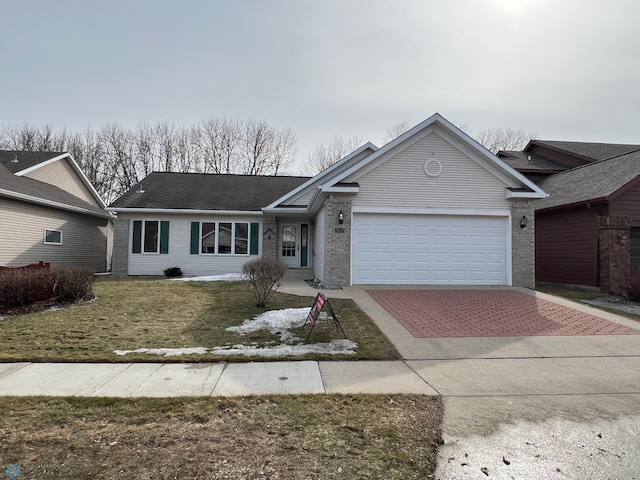 ranch-style house with a front lawn, an attached garage, brick siding, and driveway