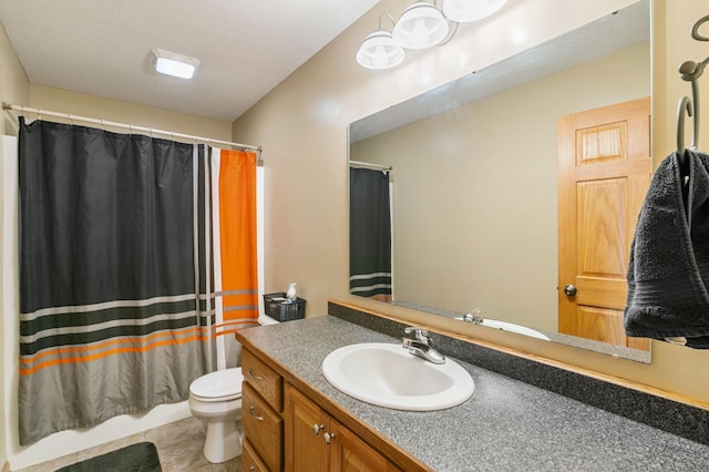 bathroom featuring vanity, toilet, and tile patterned flooring