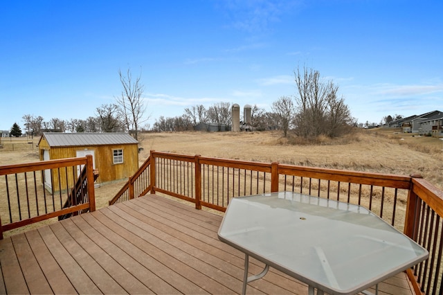 wooden deck featuring an outbuilding