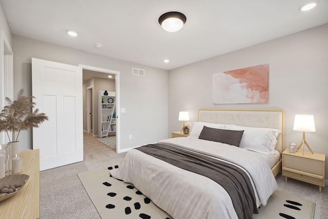 bedroom featuring baseboards, recessed lighting, visible vents, and light colored carpet