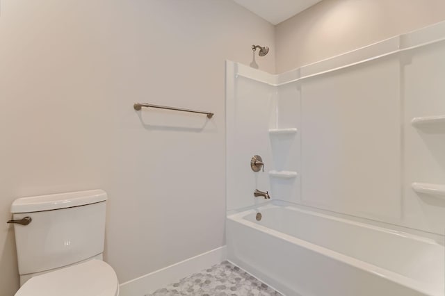 bathroom featuring  shower combination, baseboards, and toilet