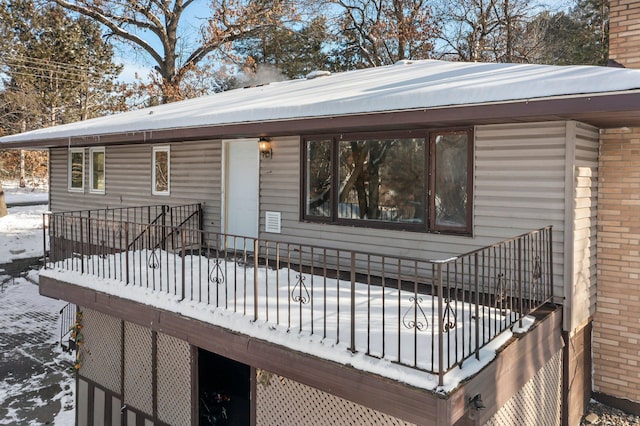 view of snow covered deck