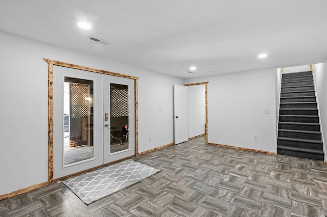 unfurnished room featuring french doors, recessed lighting, visible vents, baseboards, and stairs