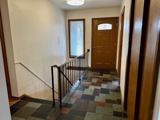 entryway with stairs and baseboards