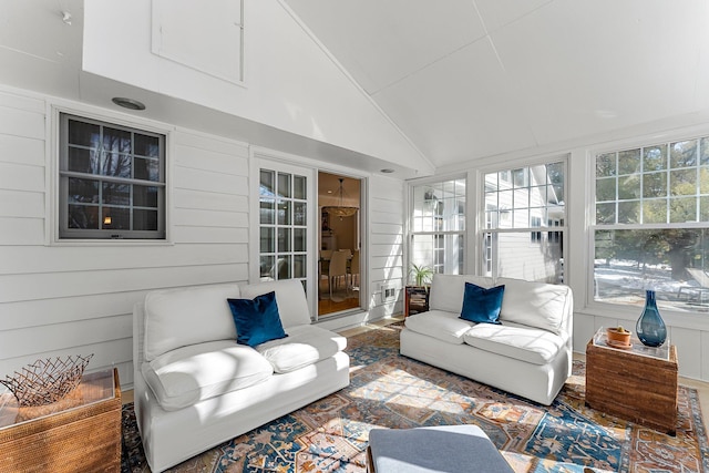 sunroom featuring a healthy amount of sunlight and lofted ceiling