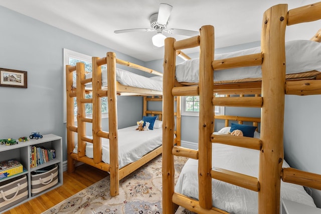 bedroom with french doors and wood finished floors