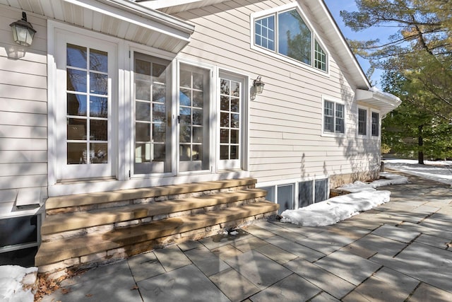 view of side of home featuring entry steps