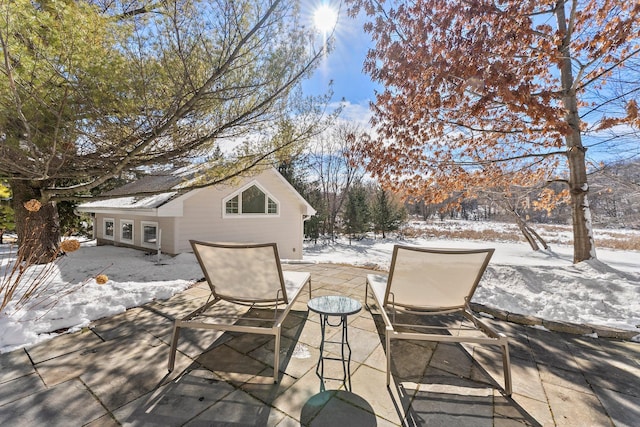 view of snow covered patio