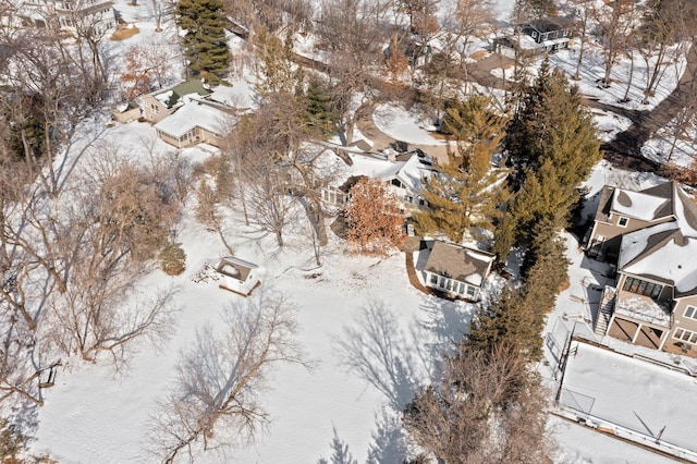 snowy aerial view with a residential view