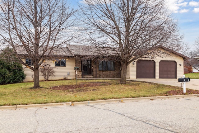 single story home with an attached garage, a front lawn, concrete driveway, and brick siding