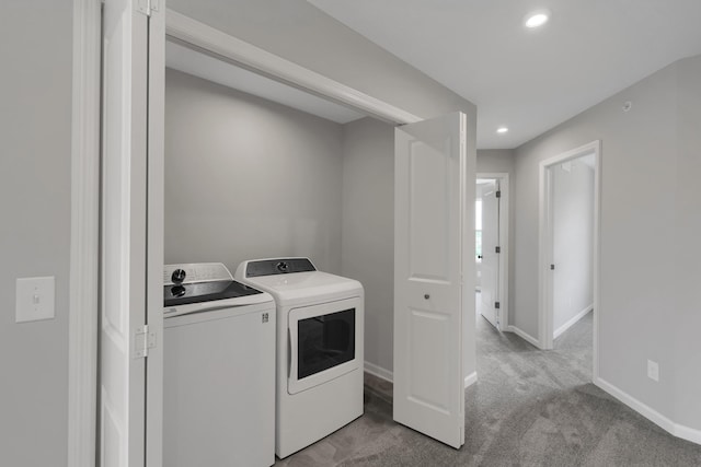 washroom featuring baseboards, washer and clothes dryer, light carpet, laundry area, and recessed lighting