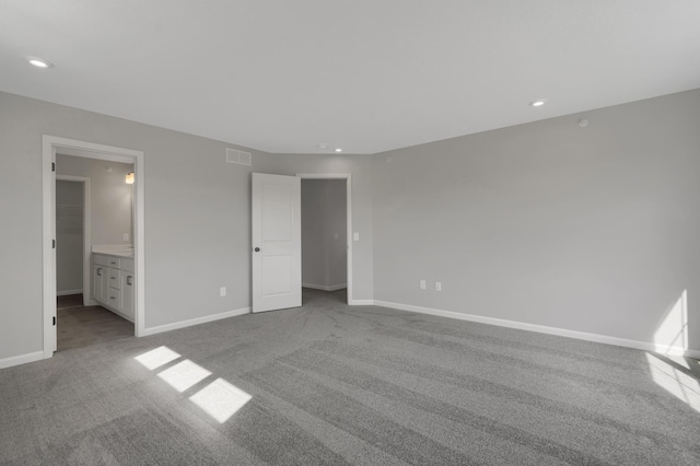 unfurnished bedroom featuring recessed lighting, visible vents, baseboards, and carpet