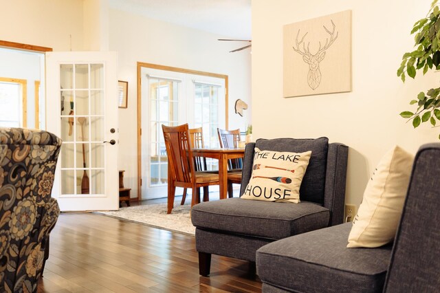 sitting room featuring ceiling fan and dark wood-style flooring