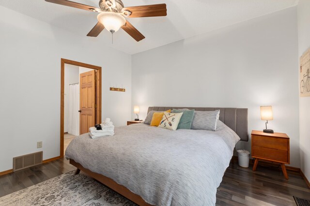 bedroom featuring dark wood-type flooring, visible vents, and baseboards