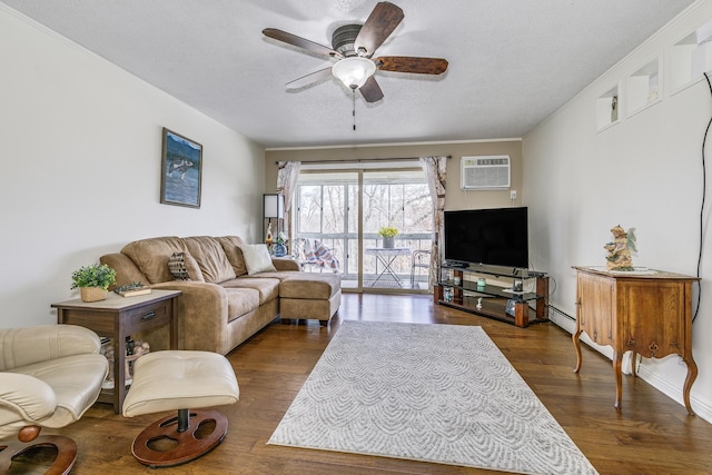 living room featuring dark wood-style floors, an AC wall unit, crown molding, and a ceiling fan