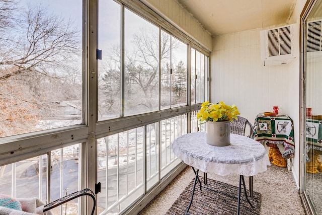 sunroom with an AC wall unit