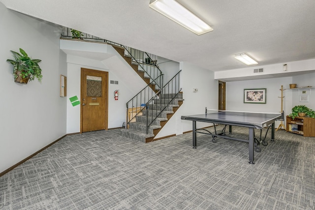 game room featuring baseboards, a textured ceiling, visible vents, and carpet flooring