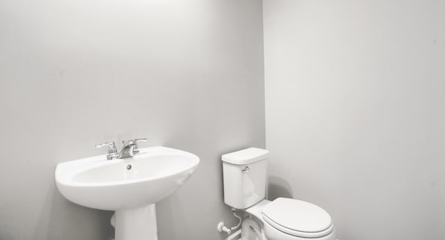 bathroom with a sink and toilet