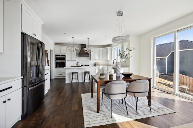 dining space with dark wood-type flooring