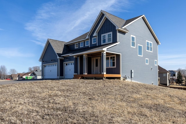 craftsman inspired home with board and batten siding, a shingled roof, a porch, a garage, and driveway