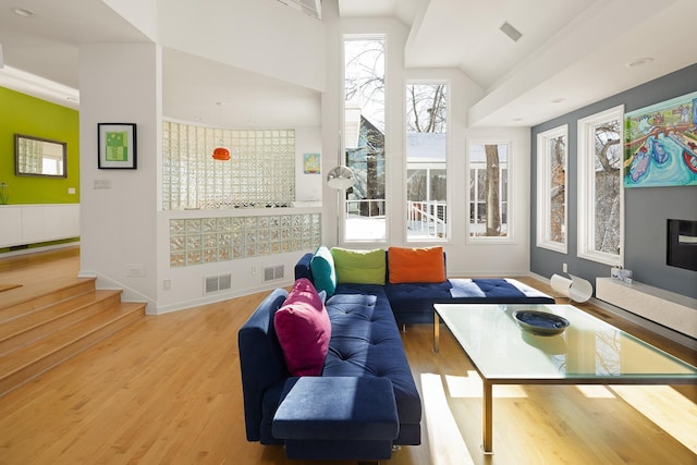 interior space with visible vents and lofted ceiling