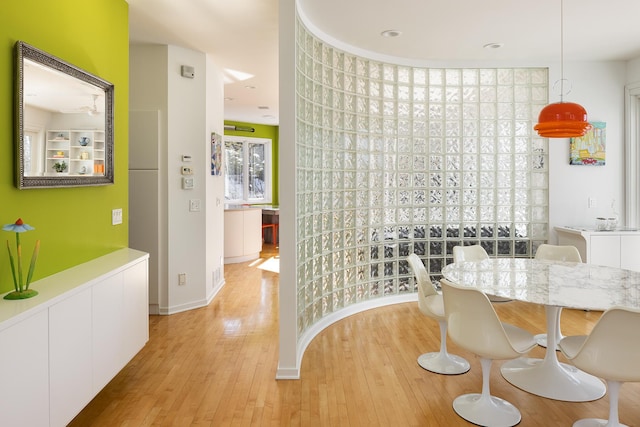 dining area featuring light wood-style floors