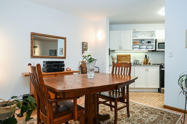 dining room with baseboards