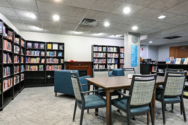 dining space with carpet floors, visible vents, a paneled ceiling, and recessed lighting