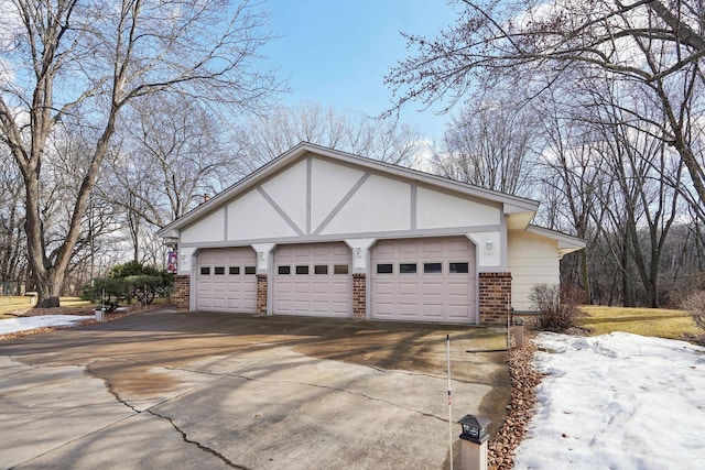 view of home's exterior featuring a garage and brick siding