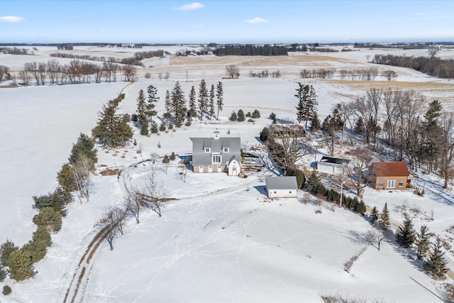 snowy aerial view featuring a rural view